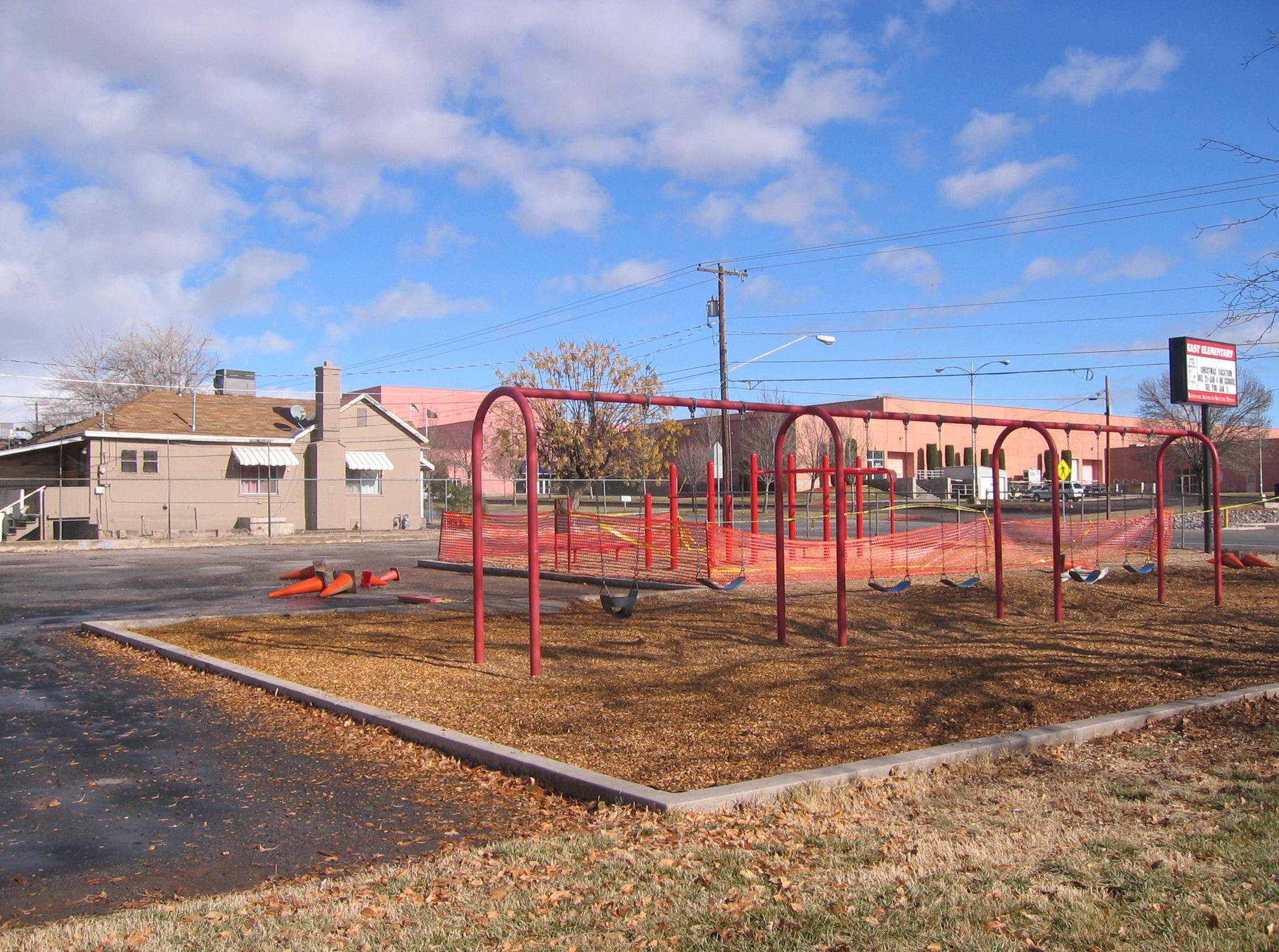 Swings and sign on the east side of East Elementary School