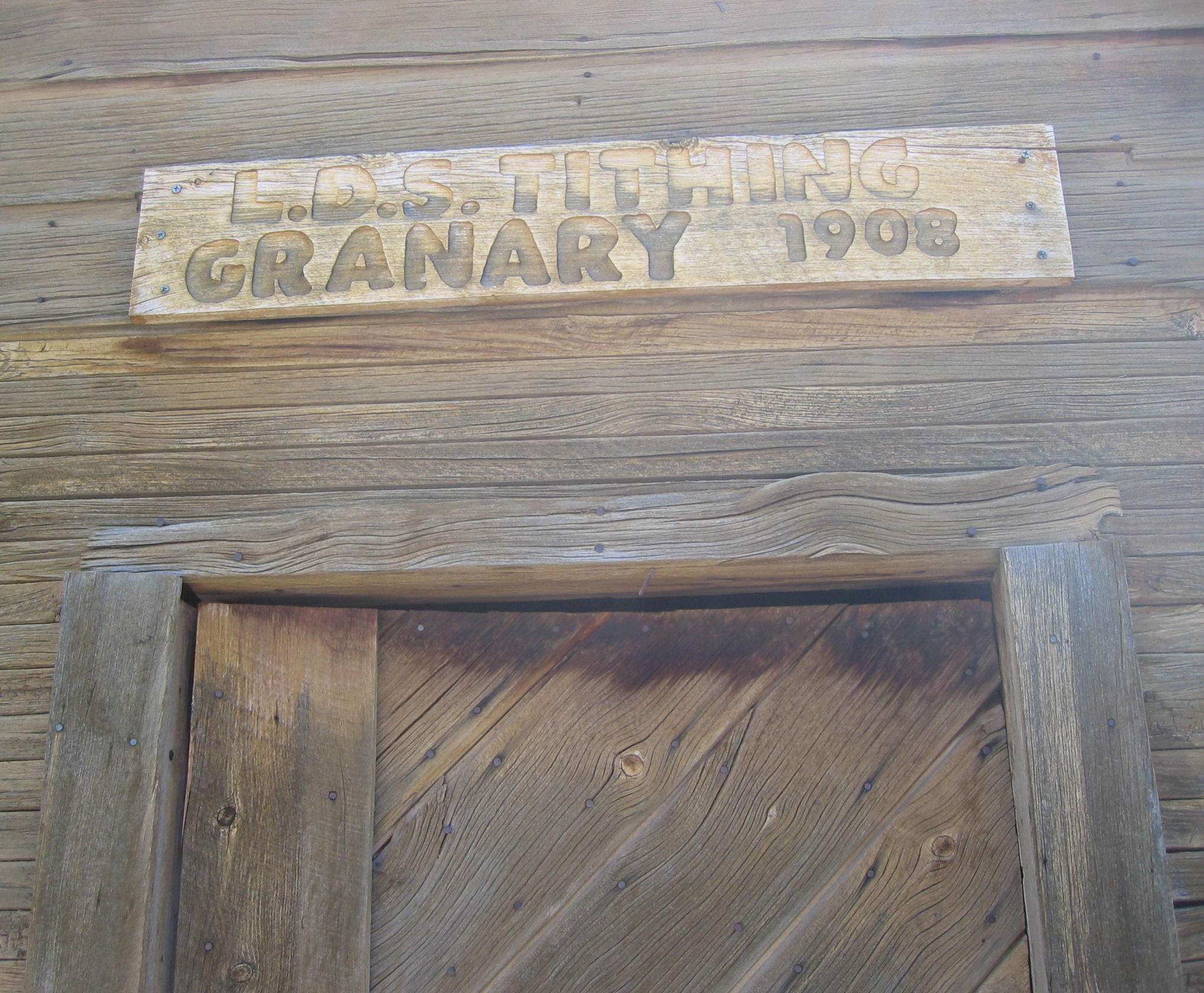 Sign above the door of the Enterprise Ward Tithing Granary