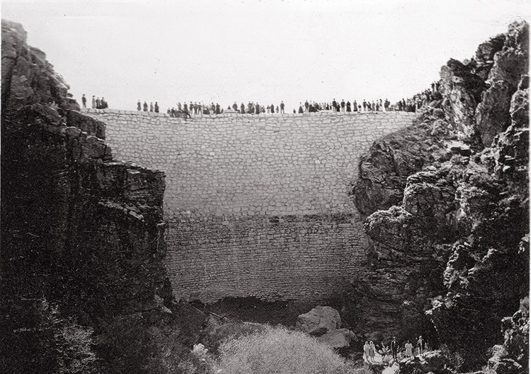 People standing on the top of the Enterprise Dam
