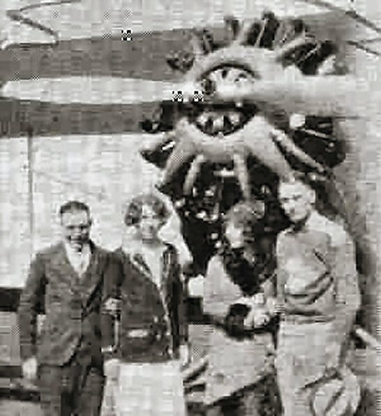 Coach Lee Hafen and three other people at the St. George Municipal Airport