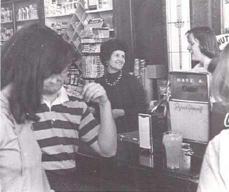 People at the soda fountain in the Dixie Drug store