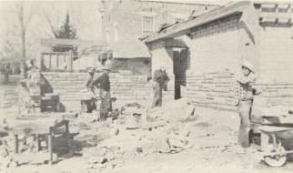 Stone masons at work on the Washington Ward Building