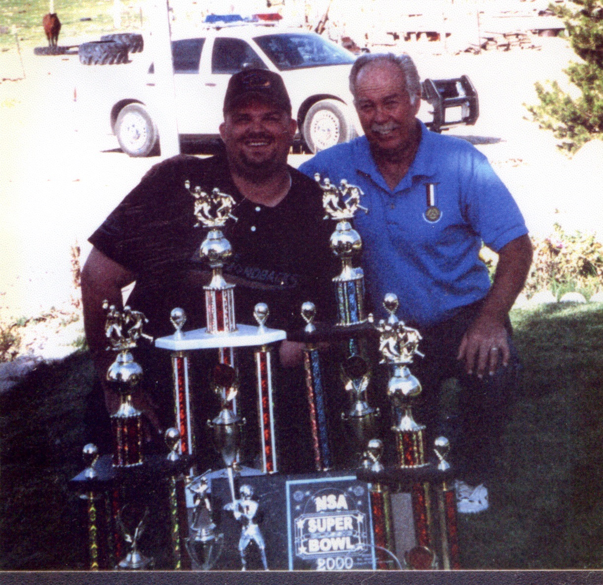 Cade Wilbur and Bill Wilbur with a 2000 MSA Super Bowl Trophy
