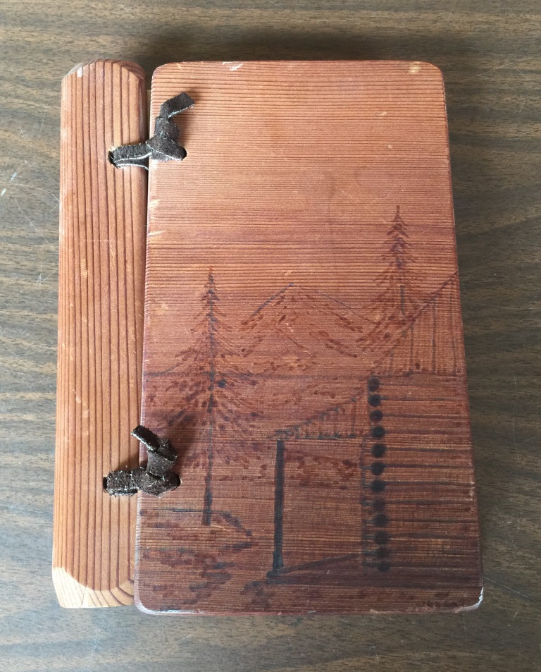 Handmade wood cover on a book