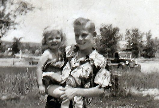 Clark Nelson holding little sister, Beverly Nelson