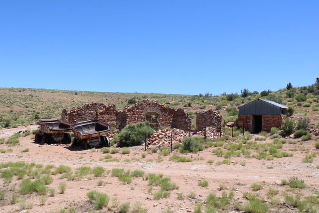 Trucks, headquarters building, and east dugout at the Grand Gulch Mine