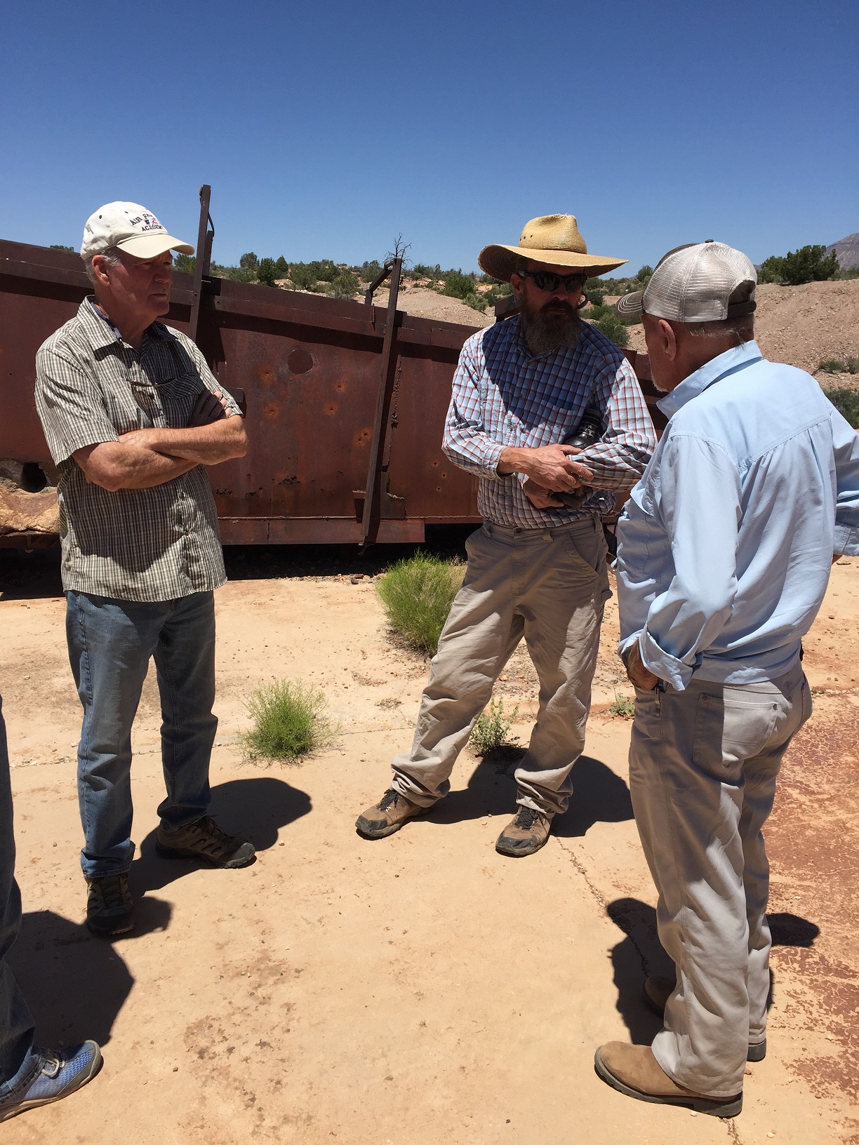 Larry Cazier, Greg Woodall, and Milt Hokanson talking at the Grand Gulch Mine