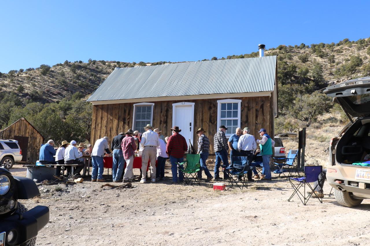 People getting lunch in front of the Jump Up Cabin on the Arizona Strip