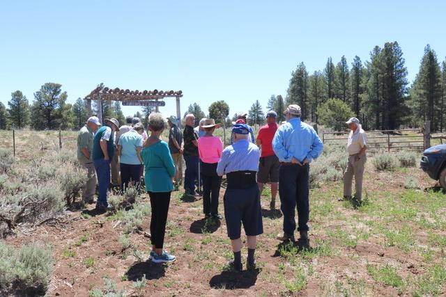 People gathered in front of the Mathis 'VT' Ranch kiosk