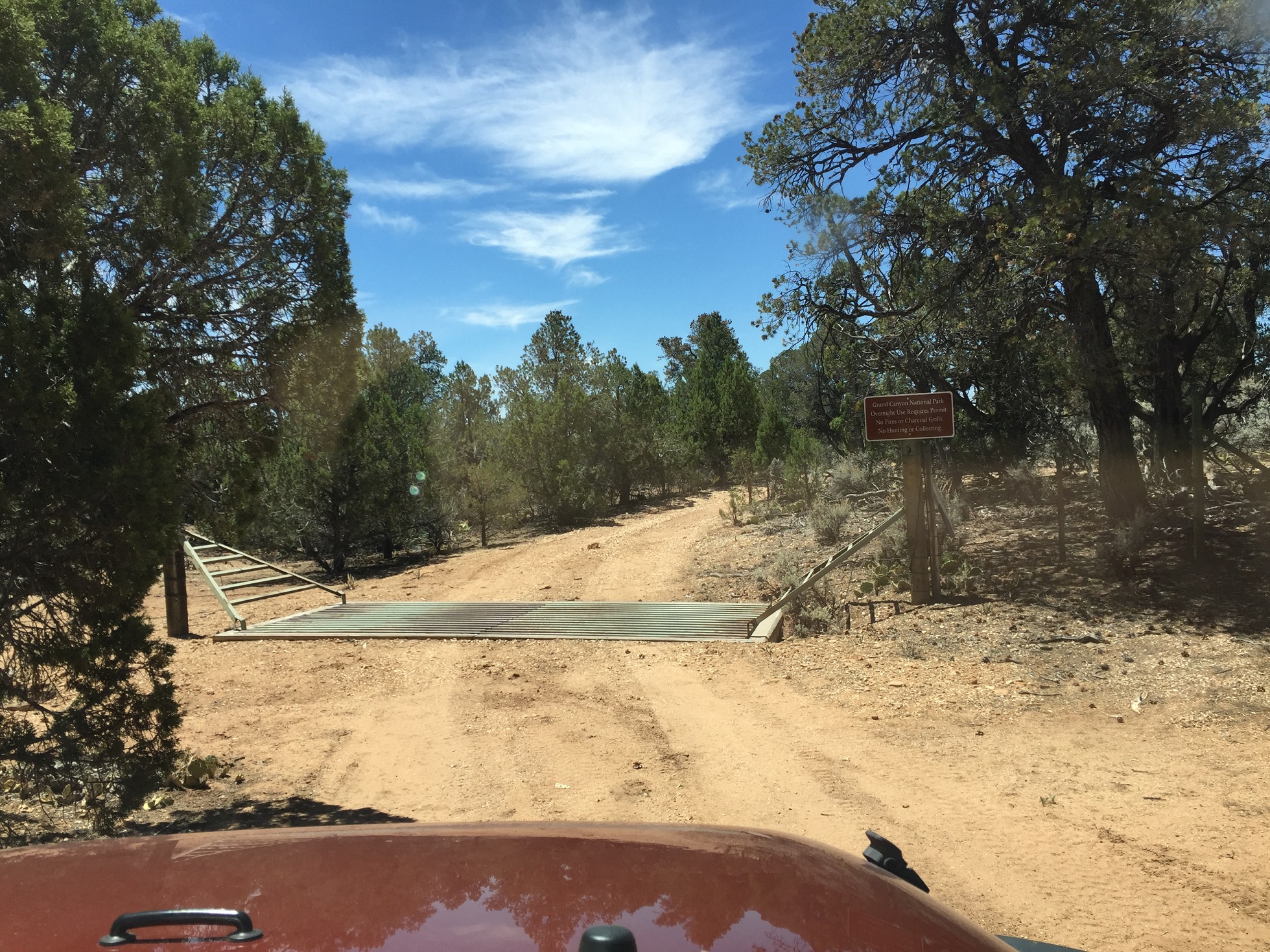 An unmarked road crossing the boundary into Grand Canyon National Park on the Arizona Strip