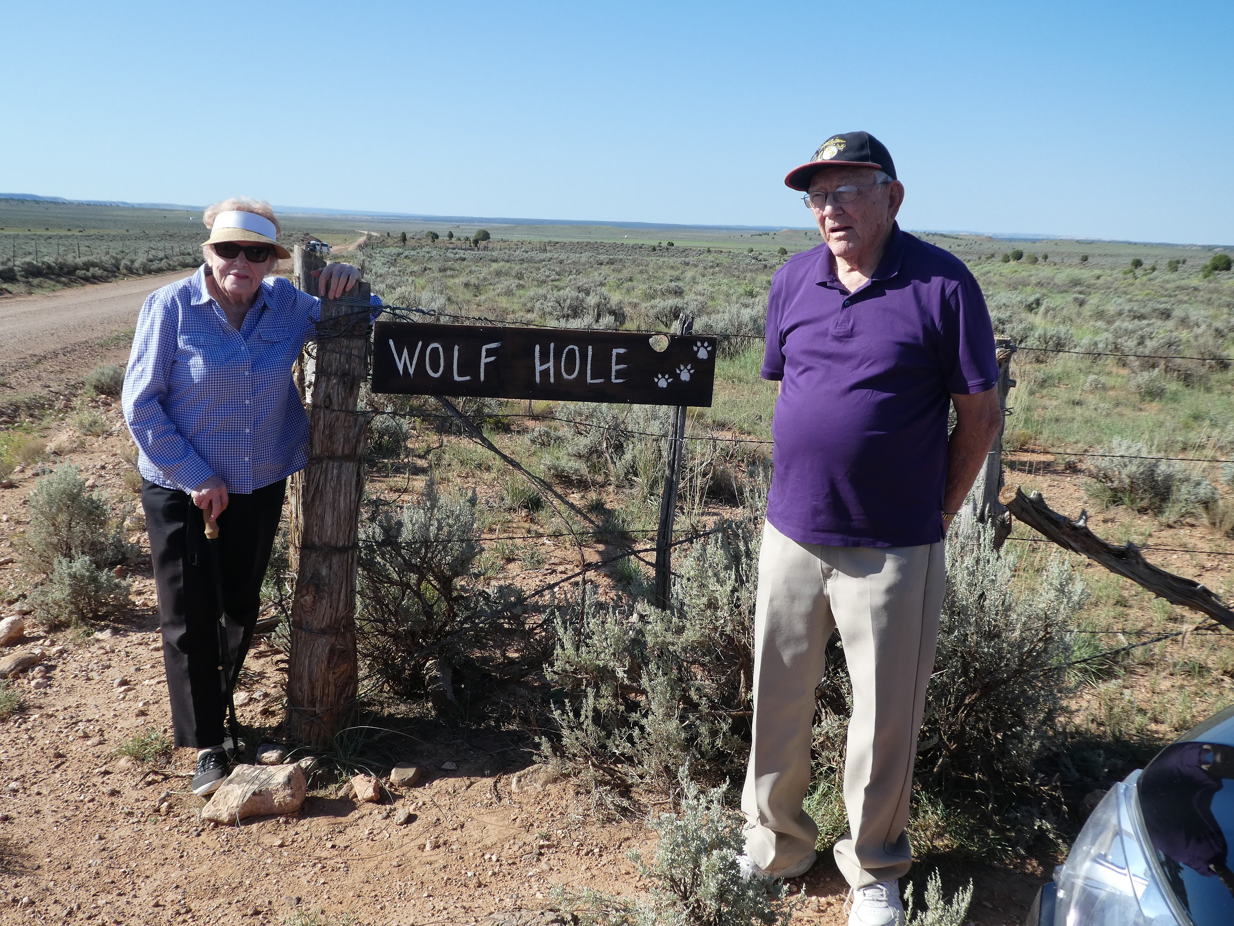 Jean & Ken Brown with the Wolf Hole sign they contributed