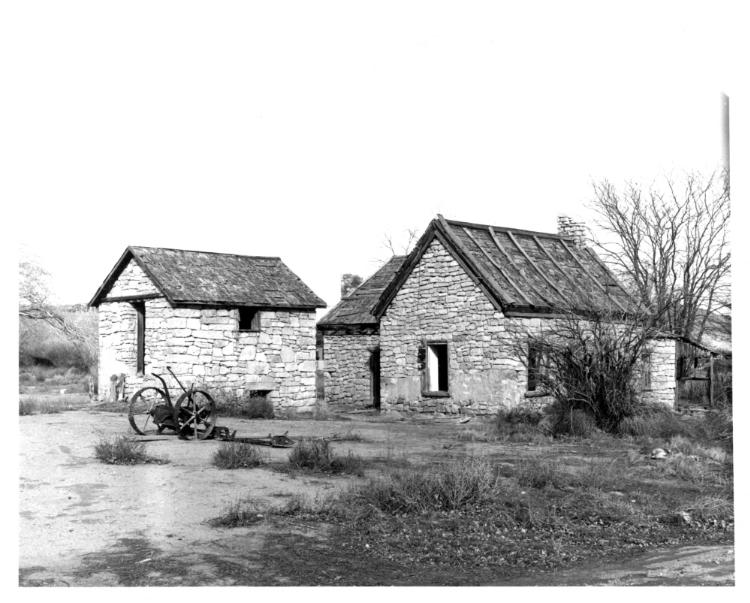 Front and west sides of the house with the grainery to the west