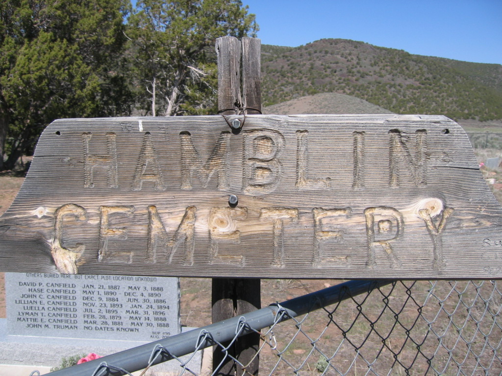 Photo of an old wood sign for the Hamblin Cemetery