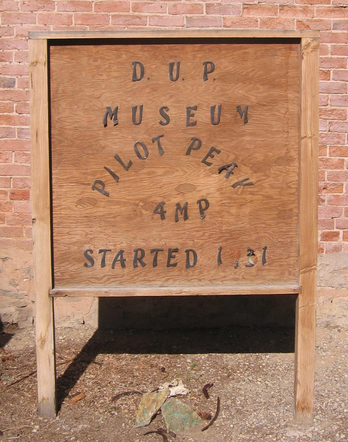 Wood sign in front of the Pilot Peak D.U.P Museum Building