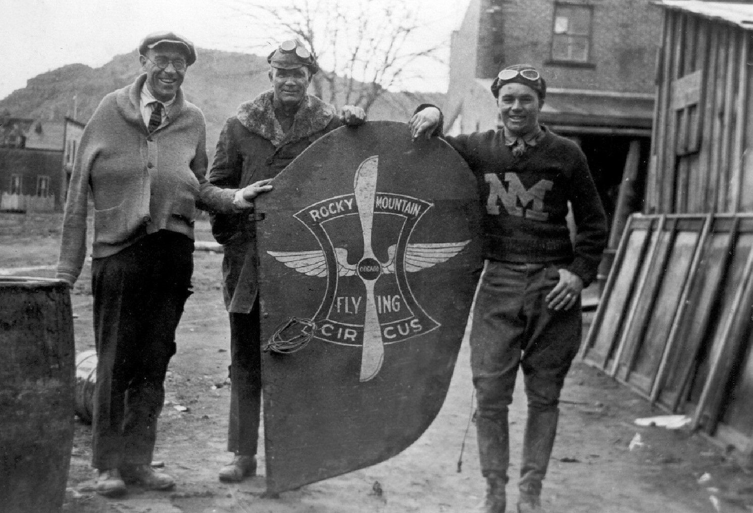 WCHS-01097 Gus Backman, Warren Cox, and Tommy Thompson with tail of their wrecked airplane