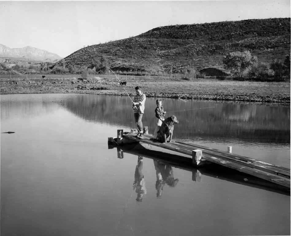 Sheldon and Bruce Nisson fishing at a pond