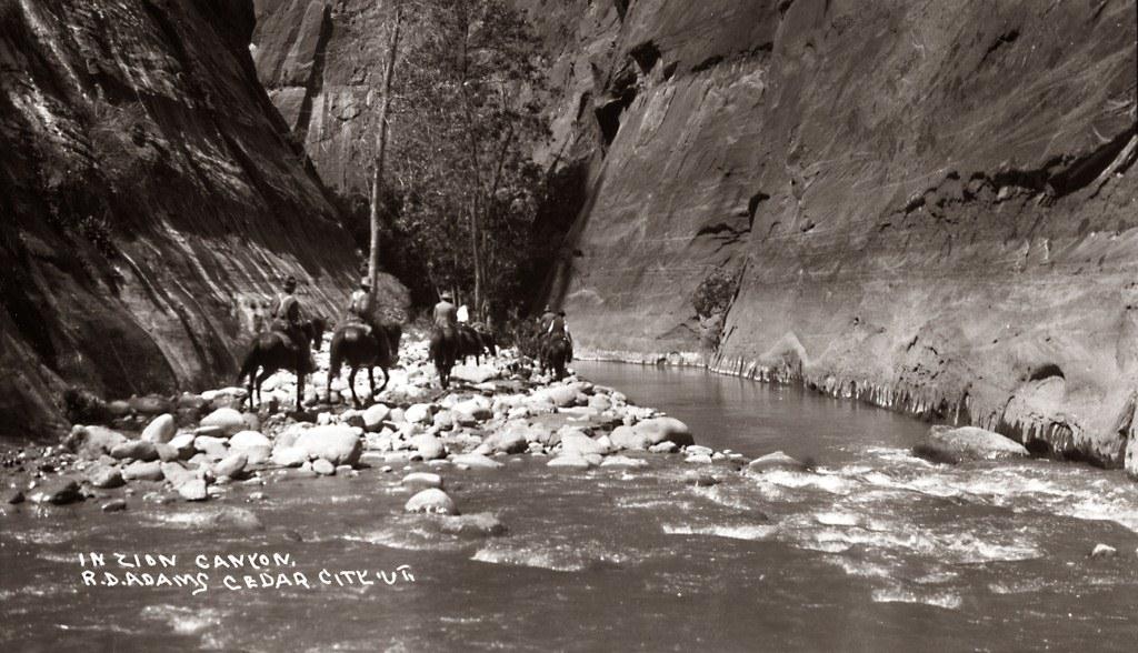 Men on horses in Zion Canyon