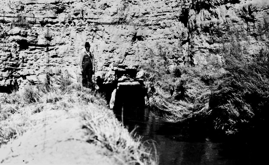 Will Hinton standing next to a tunnel on the Hurricane Canal