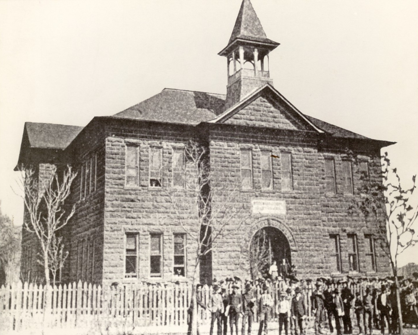 Group of people in front of the Woodward School