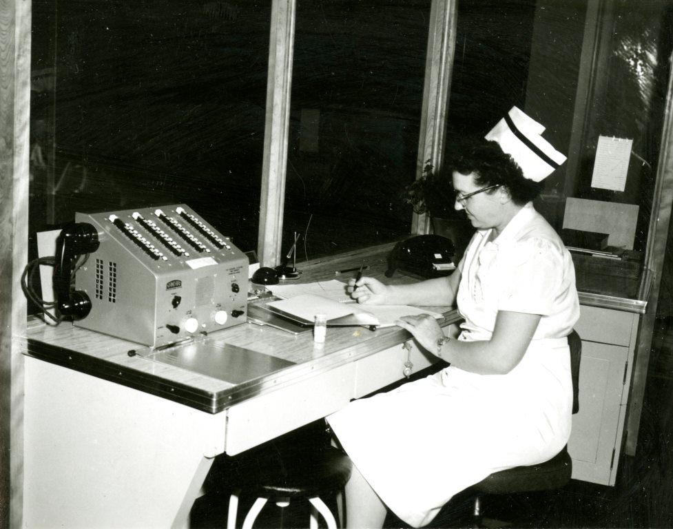 Marie Cottam at the switchboard of the Dixie Pioneer Memorial Hospital