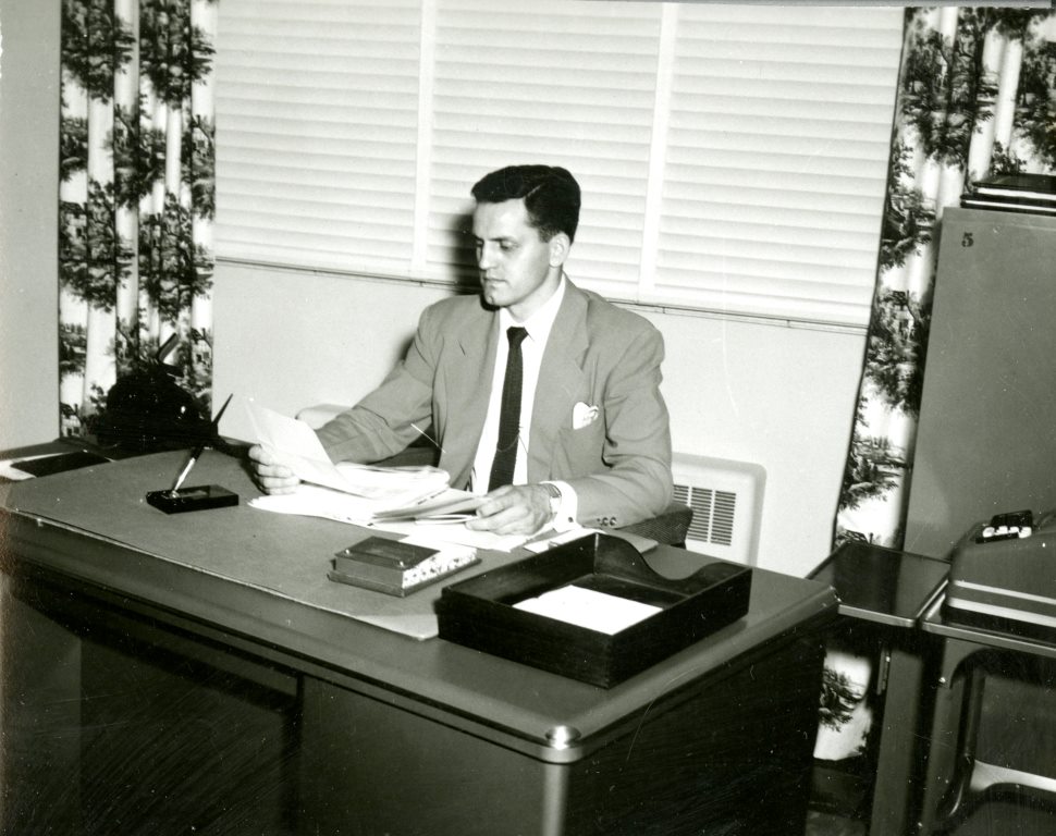 Fred K. Holbrook working in his office at the Dixie Pioneer Memorial Hospital