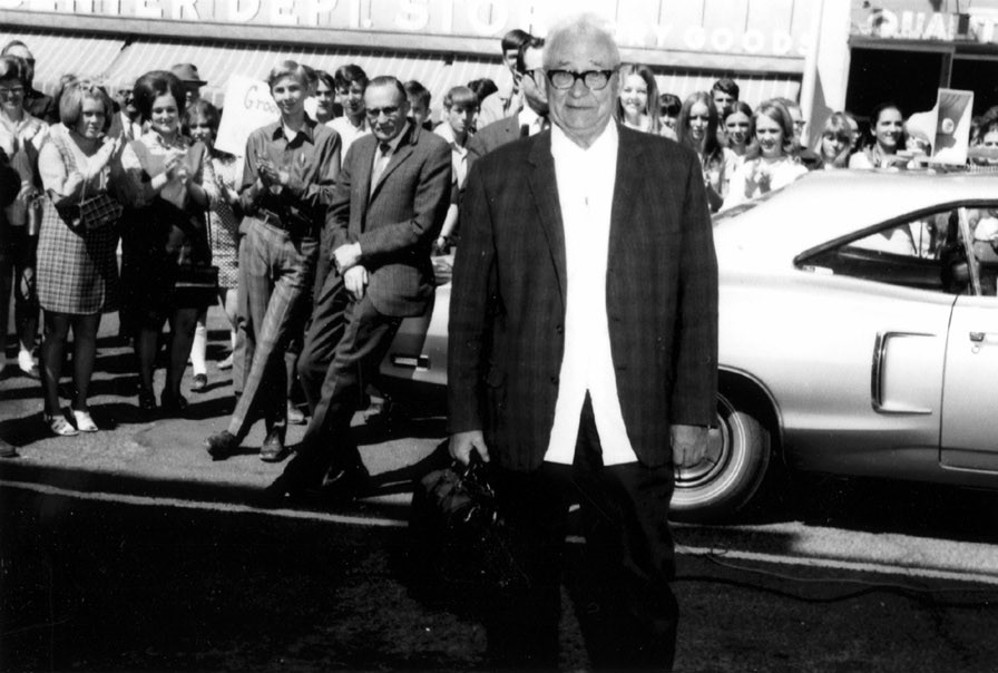 Dr. Reichmann with a crowd of people out in front of his office