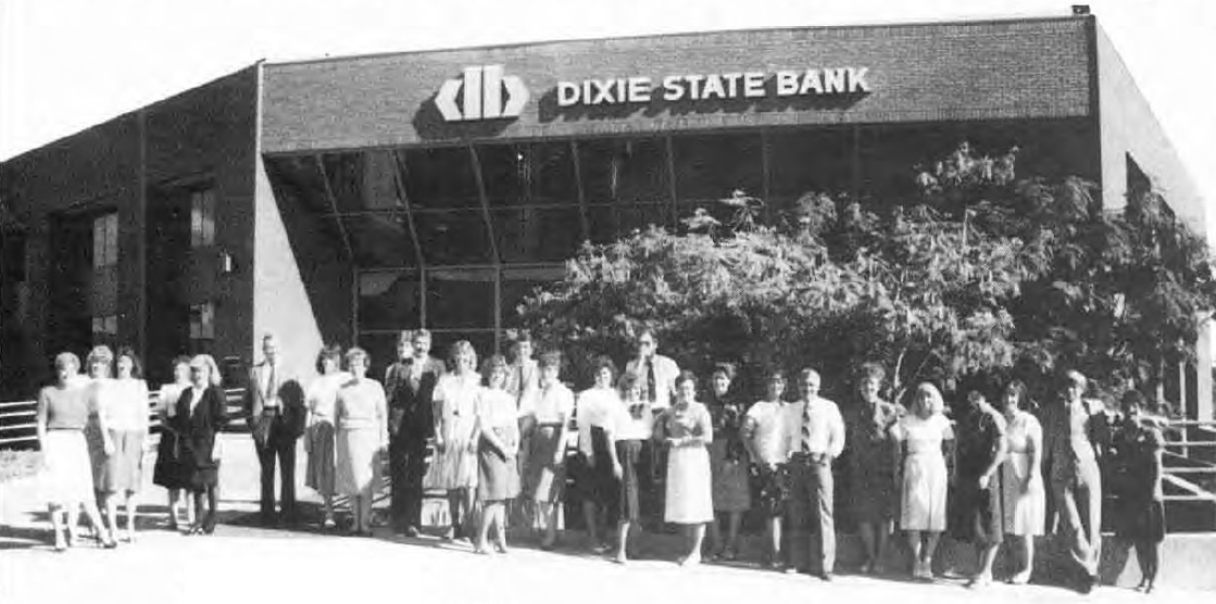People standing in front of the Dixie State Bank