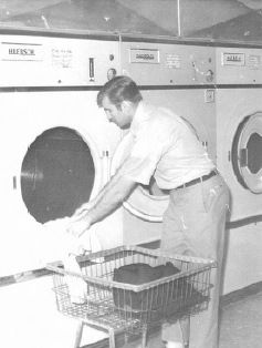 man doing his laundry at Carefree Coin Laundry & Dry Cleaning