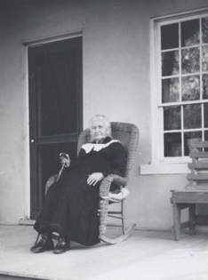 Ann Cannon Woodbury sitting on her porch