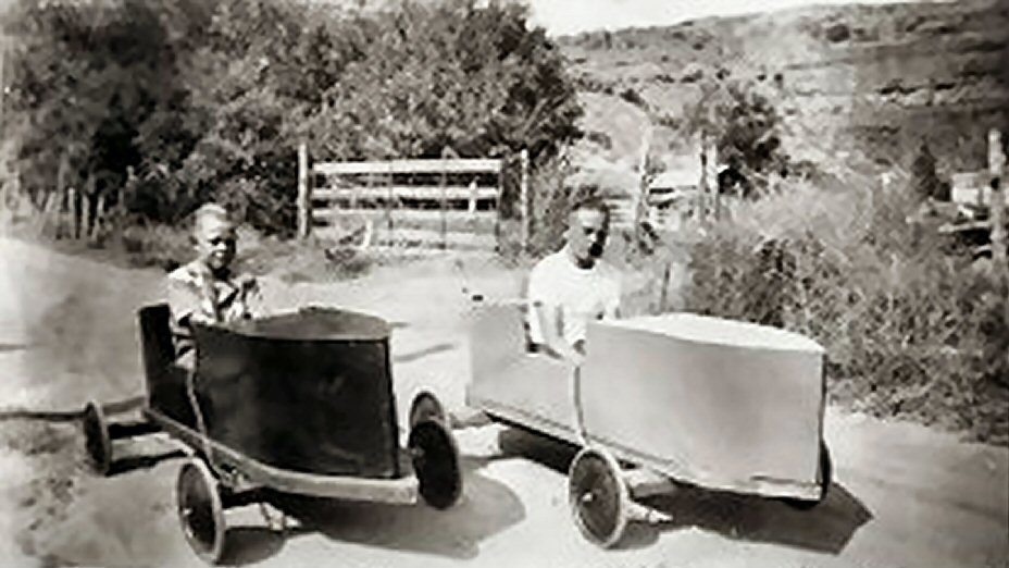 Ross Higgins and Larry Higgins in their soap box derby cars