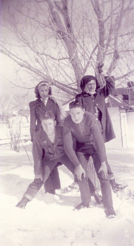 Four people in front of the Albert Bunker home in Veyo