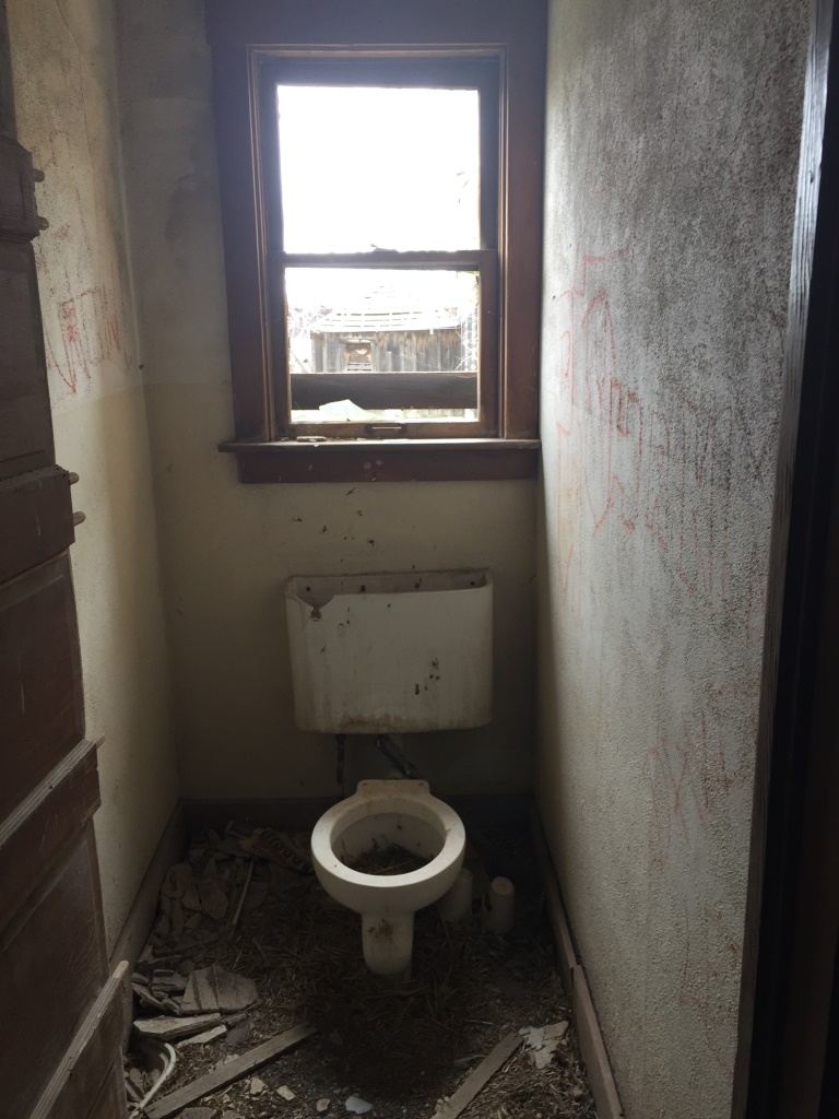 Bathroom with toilet in the ruins of the old hotel in Modena