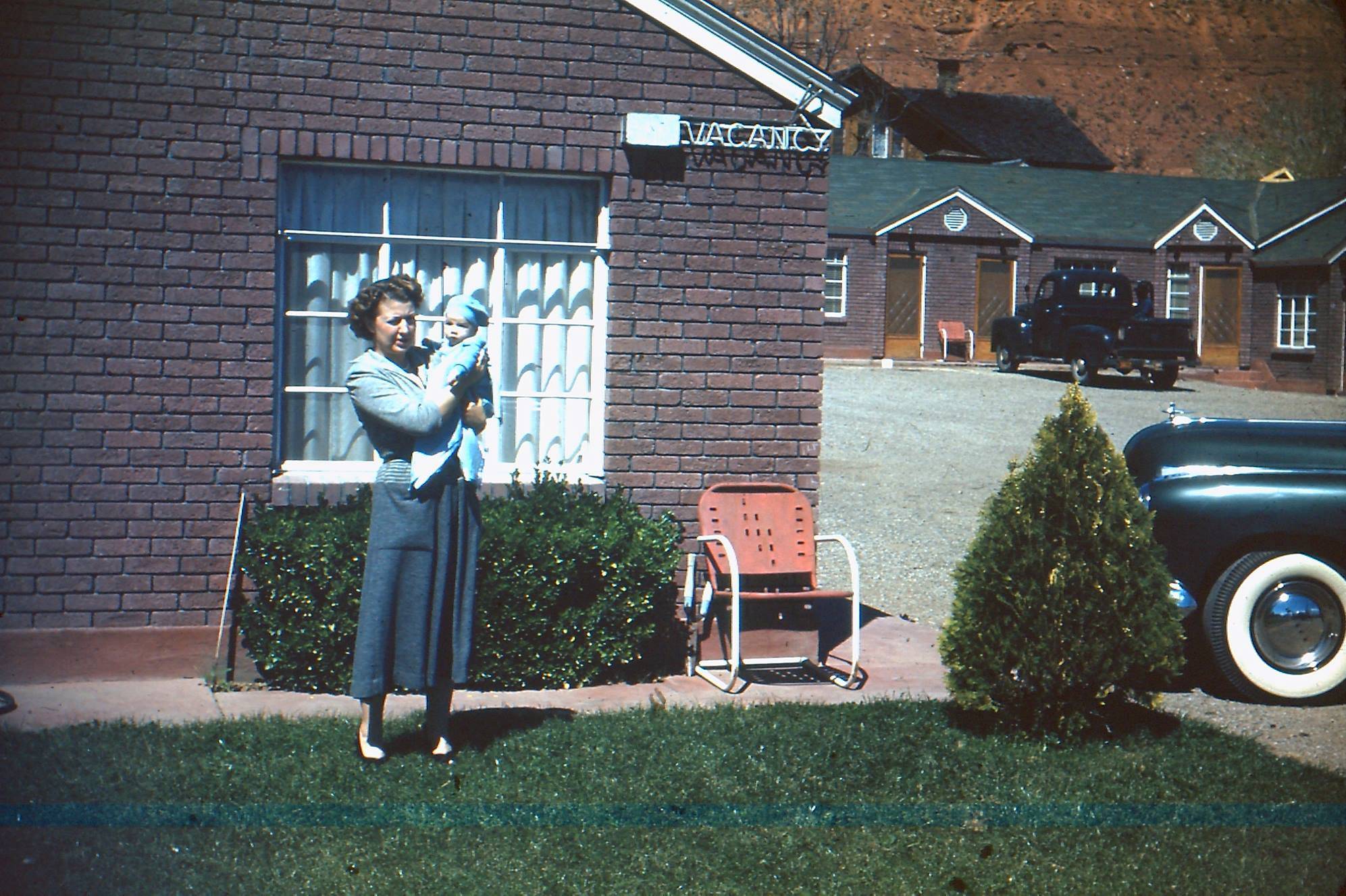 Shirley Hail and son, John, in front of the Hail's Motel in St. George