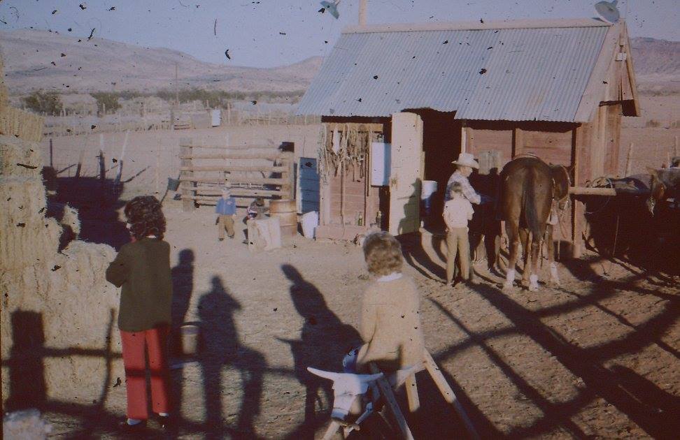 Iliff Andrus with some family members at the tach shed on the Andrus Farm