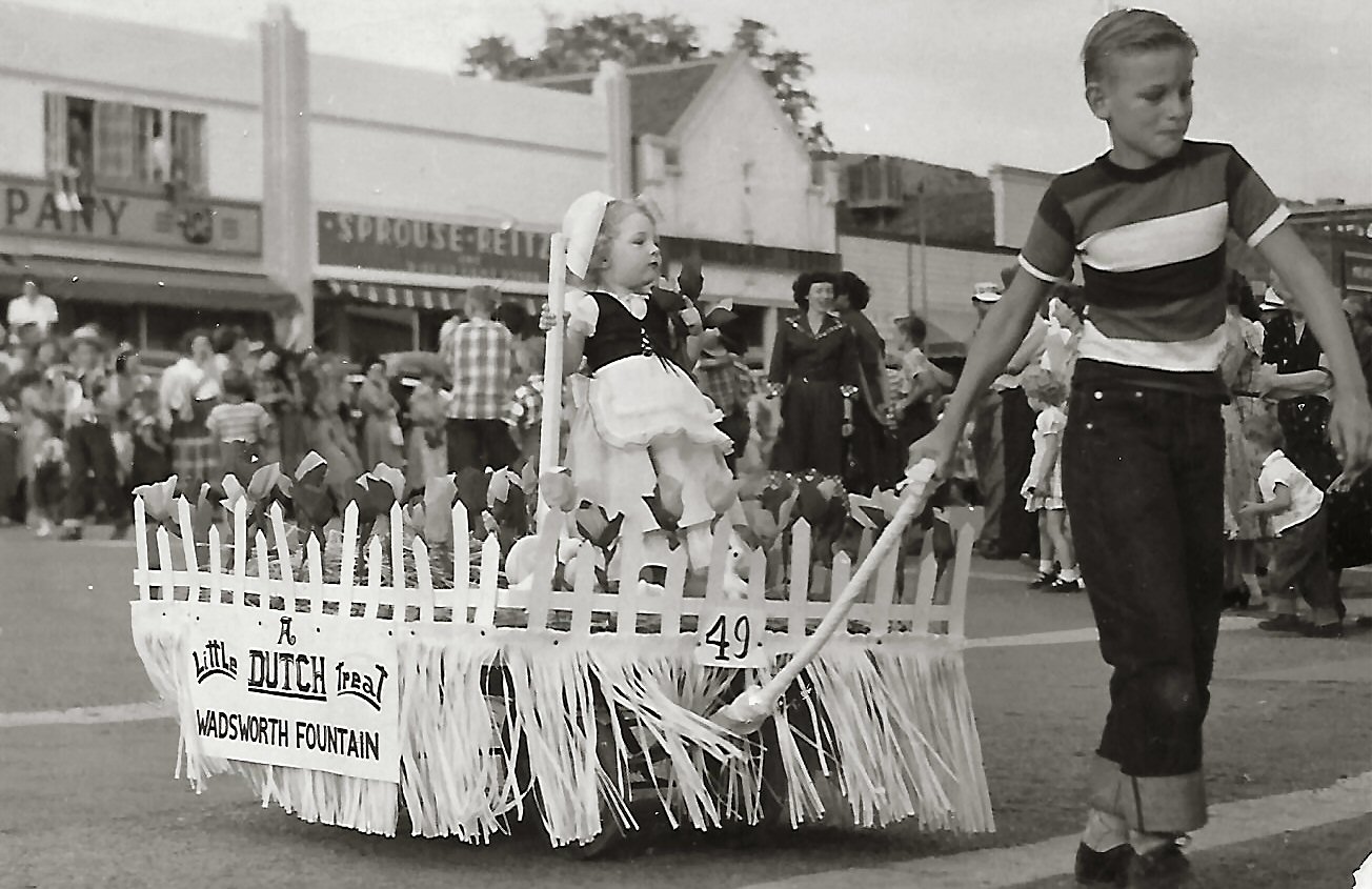 Clark Nelson pulling a float with his little sister, Beverly Nelson