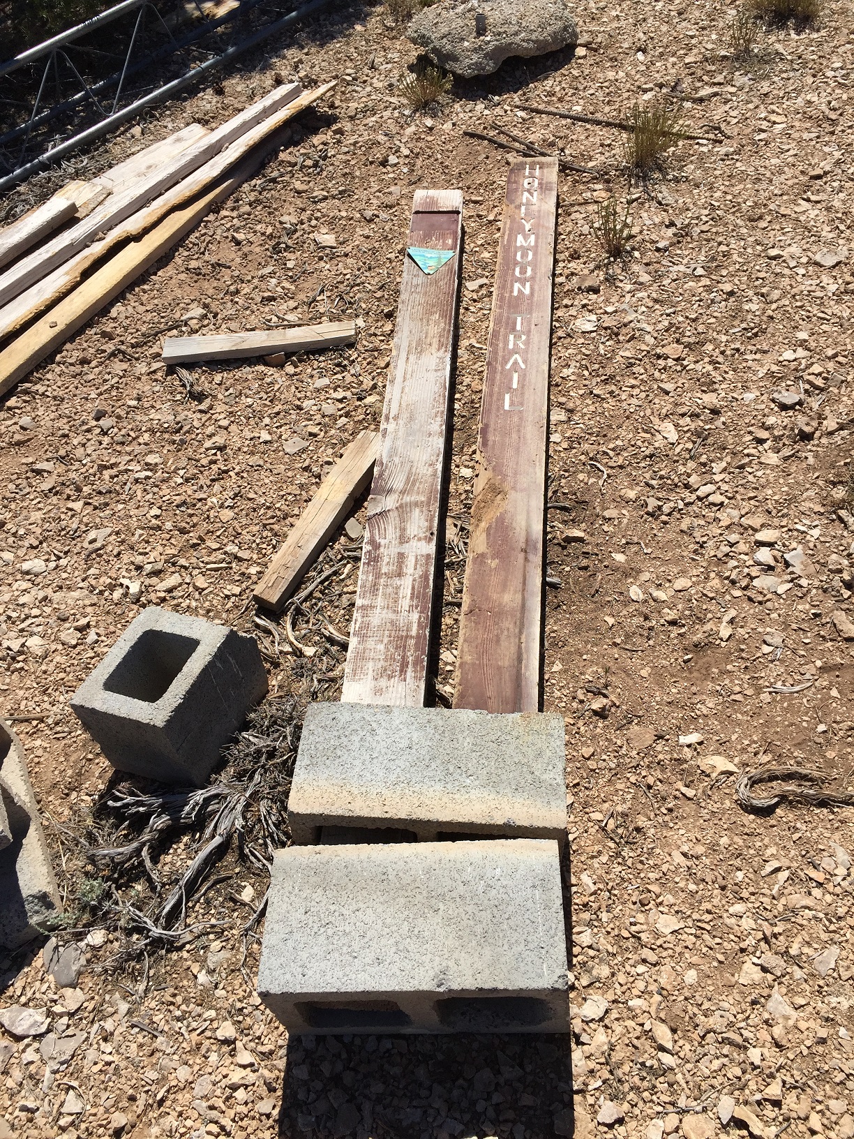 A Honeymoon Trail marker laying on the ground at Hudson Point on the Arizona Strip