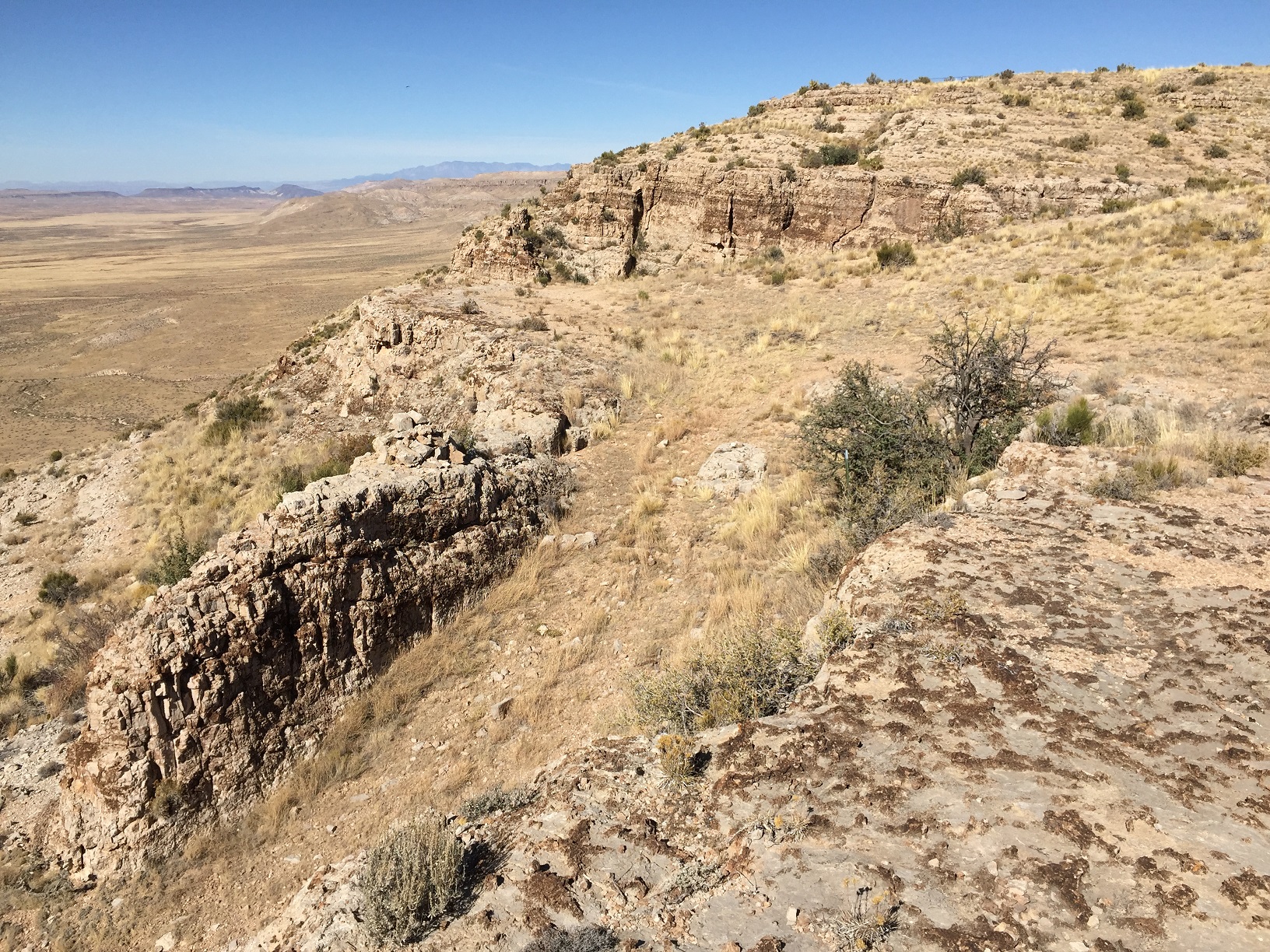 Temple Trail starting down off of the Hurricane Cliffs through a dugway cut through a rock