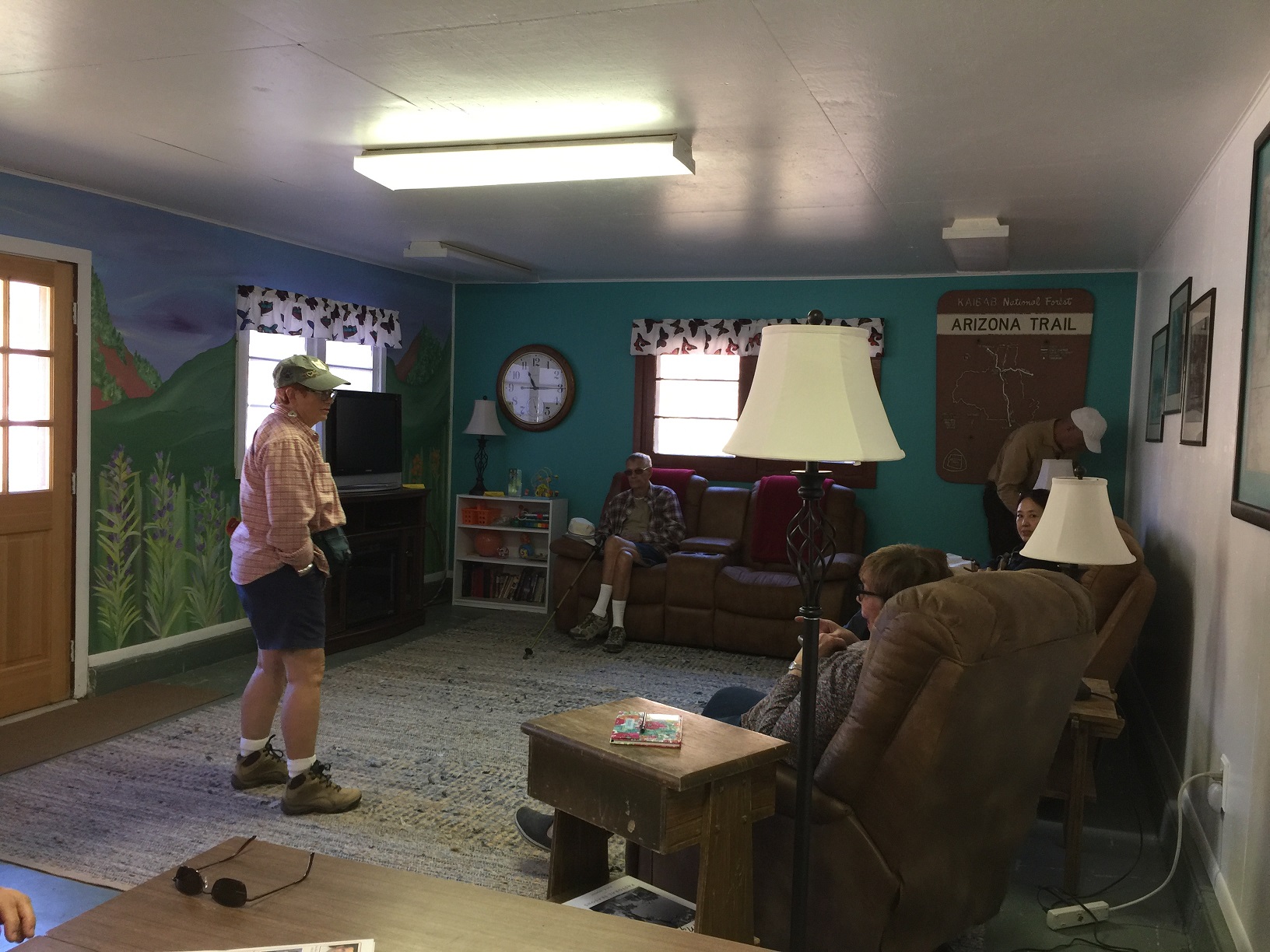 DASIA field trip participants in the common living room at the Big Springs Rental Cabins