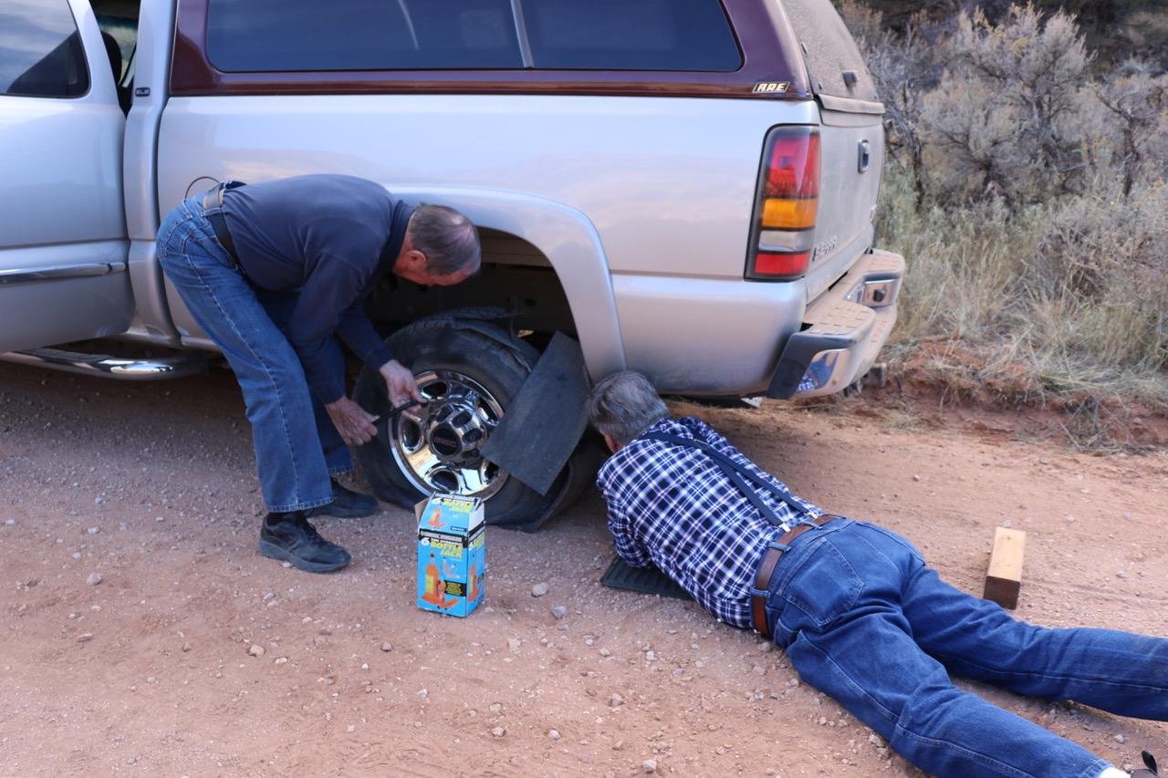 Dale Barnes and ??? removing a flat tire along Forest Service Road 423 on the Arizona Strip