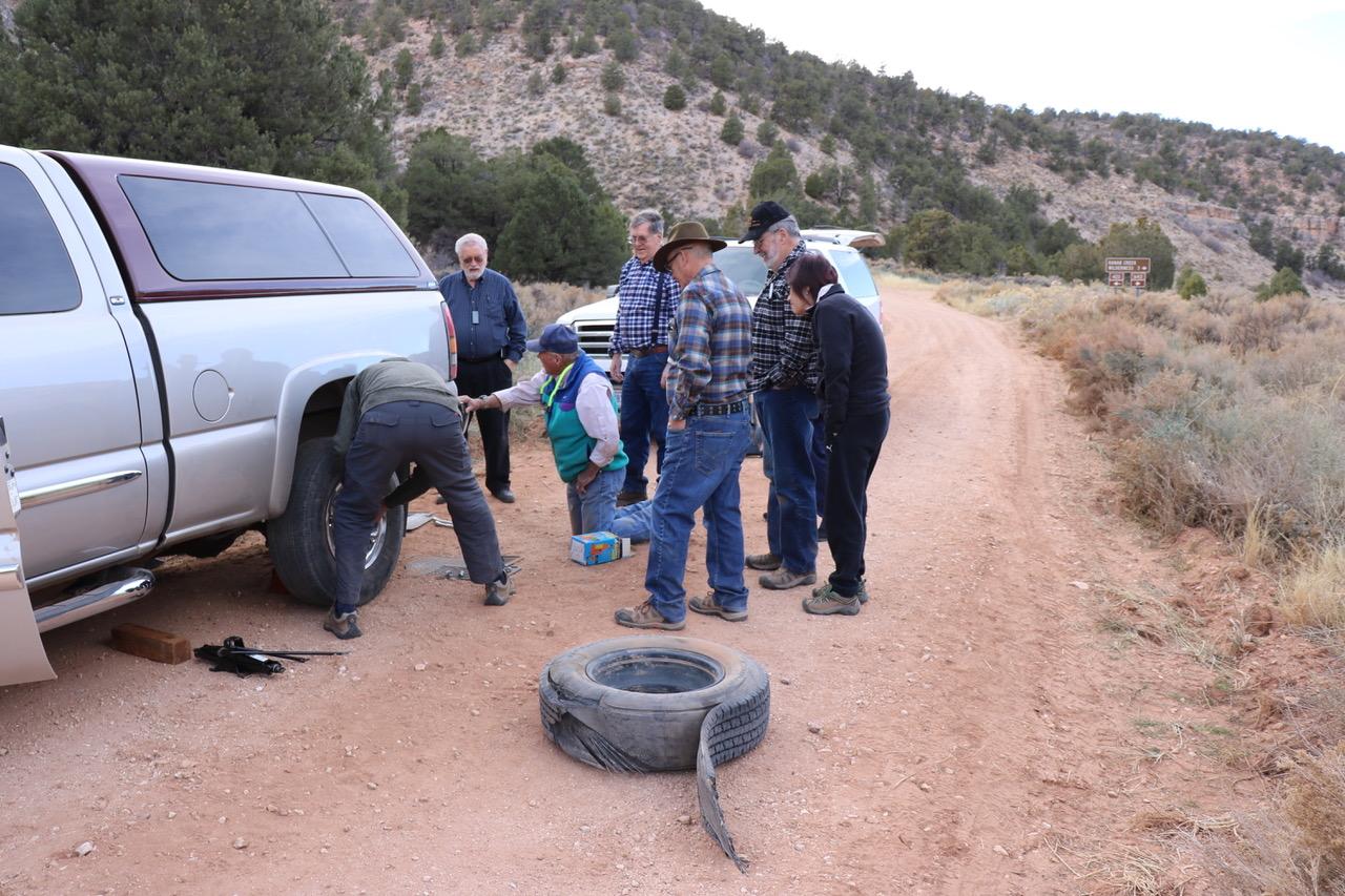 People changing a tire on Forest Service Road 423 on the Arizona Strip