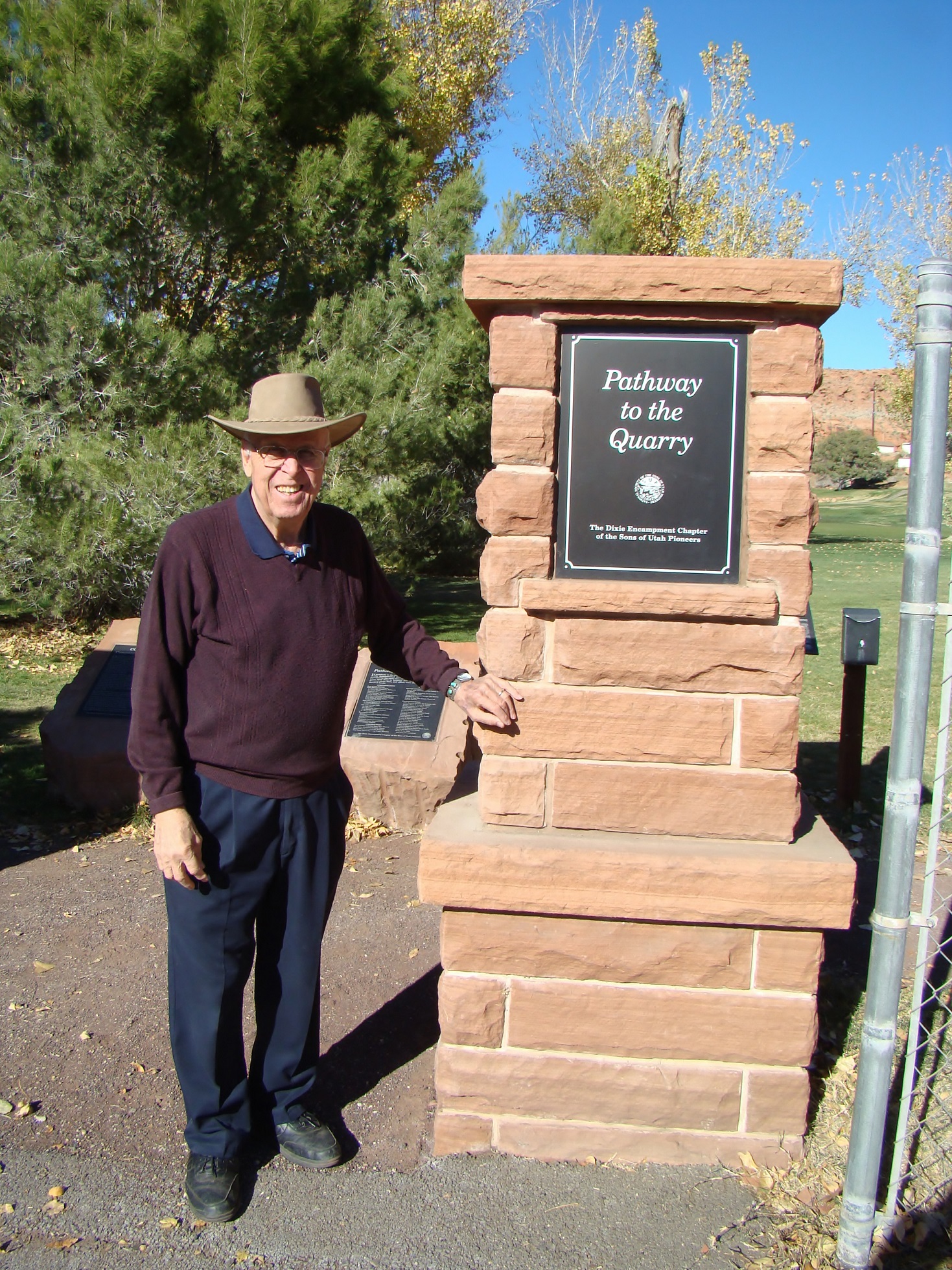 Dr. Wayne Pace standing at the St. George Sandstone Quarry Trailhead