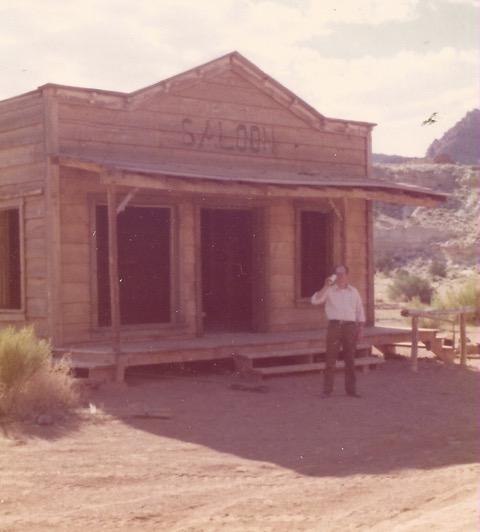 Daris Clegg in front of the movie set saloon in the ghost town of Paria, Utah