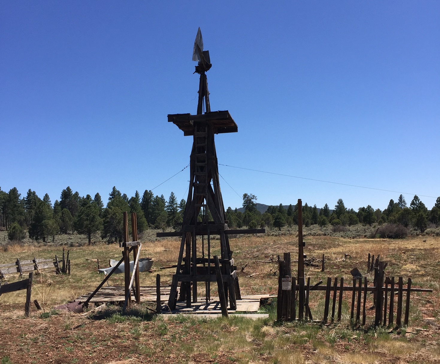 A windmill at the Pine Cabin with Mt. Dellenbaugh in the background