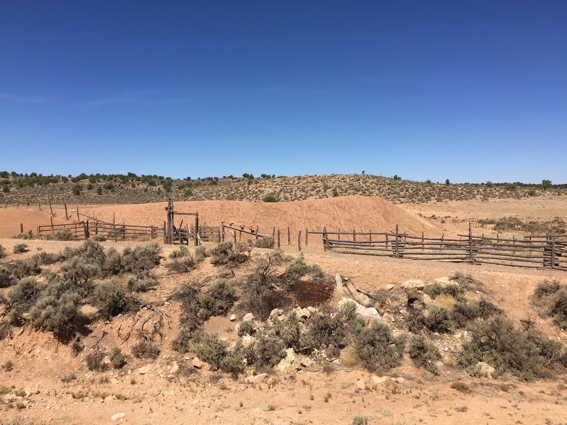 A corral and water retention pond on the Arizona Strip