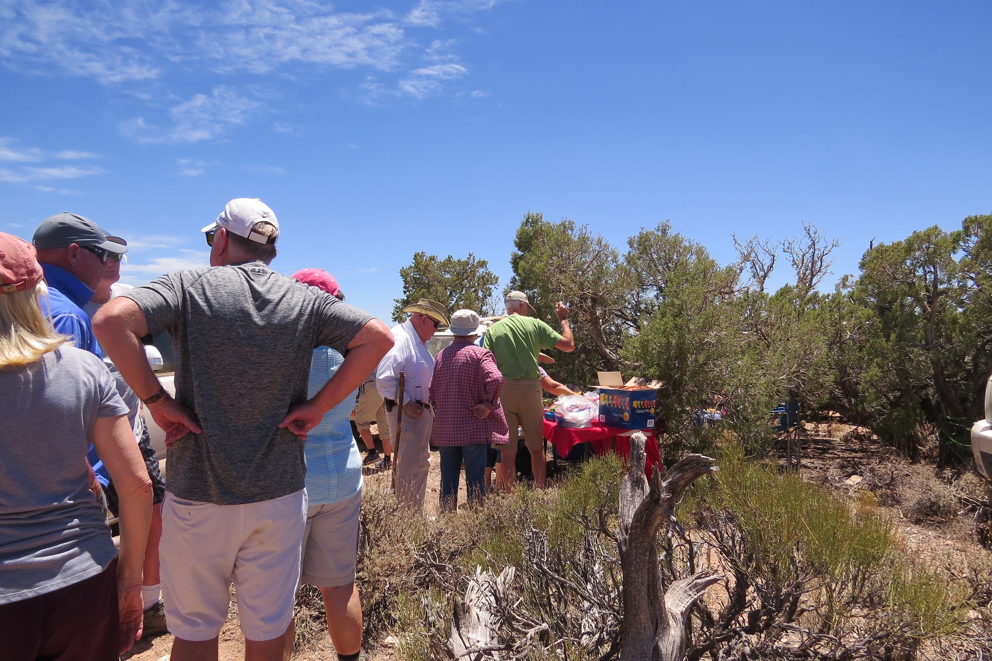 DASIA field trip people lined up for the buffet lunch at Kanab Point on the Arizona Strip