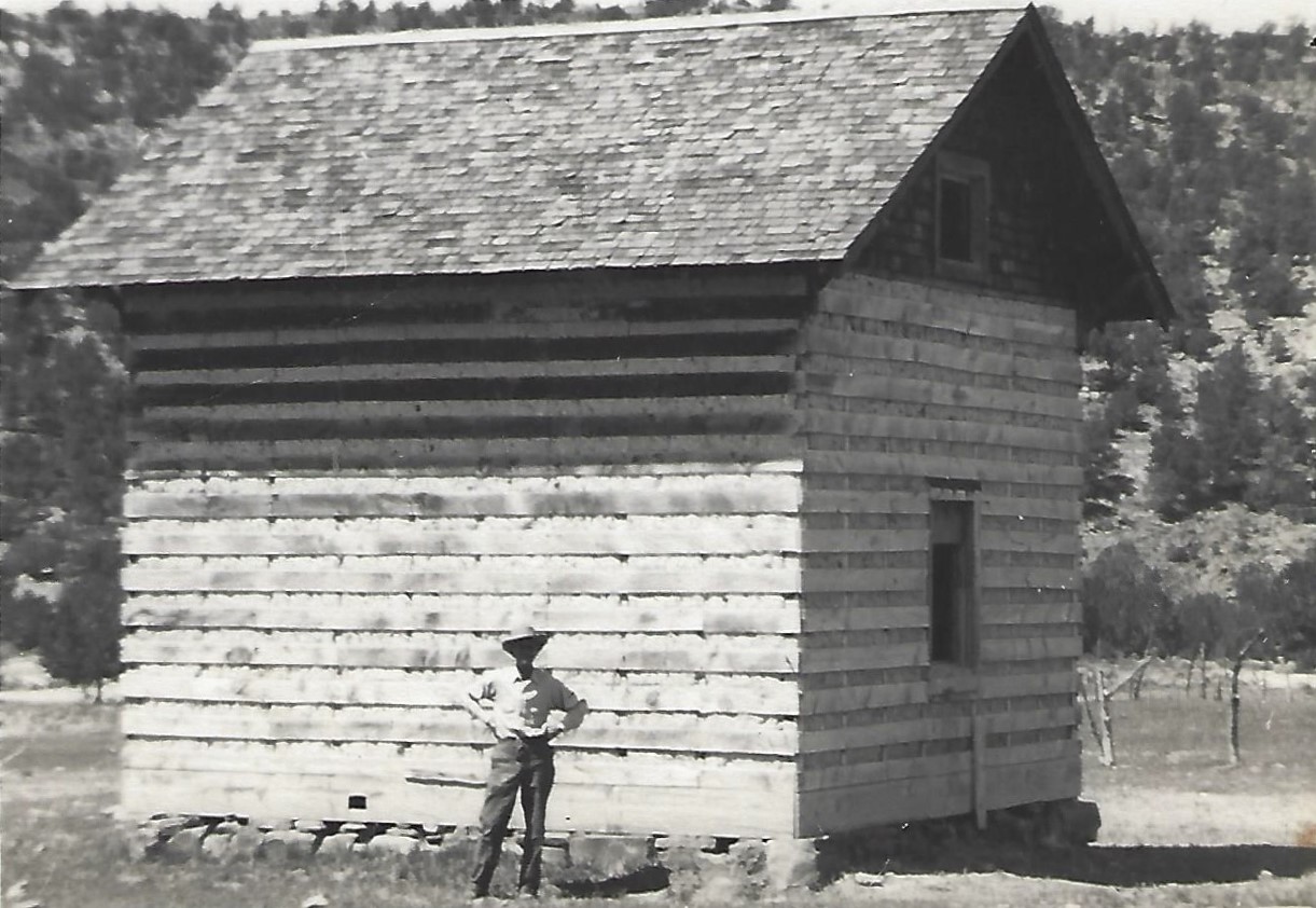 James Guerrero beside the Guerrero Camp House at Jackson Spring in Motoqua, Utah