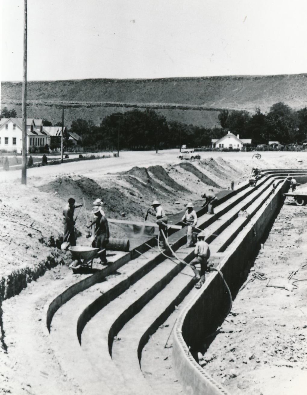 Workers constructing the cement benches on the south side of the Dixie Sun Bowl