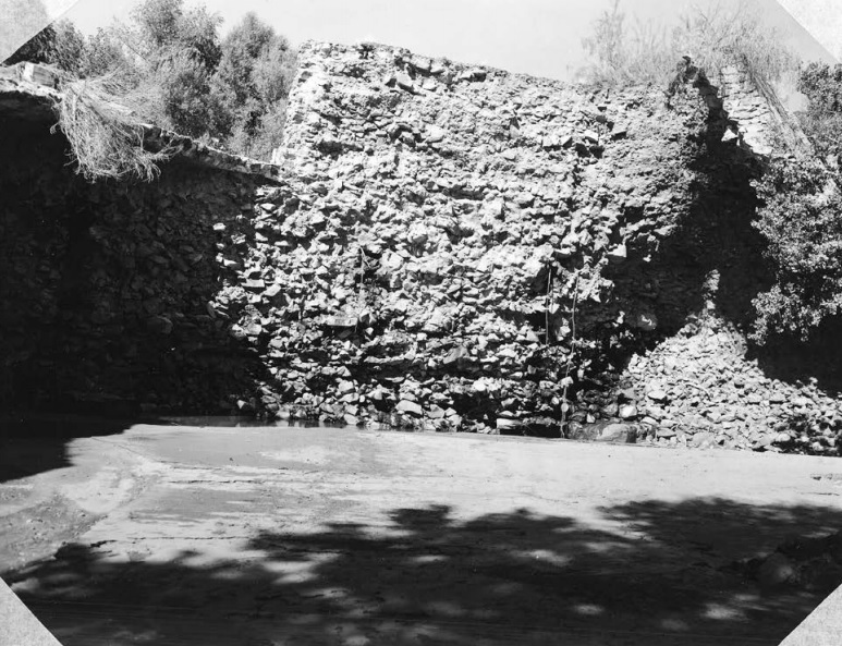 Downstream face of the Shem Dam spillway, showing the 1955 flood damage