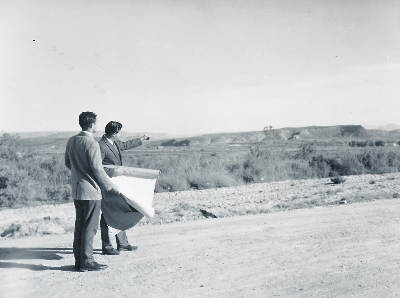 Two men examining some property in St. George
