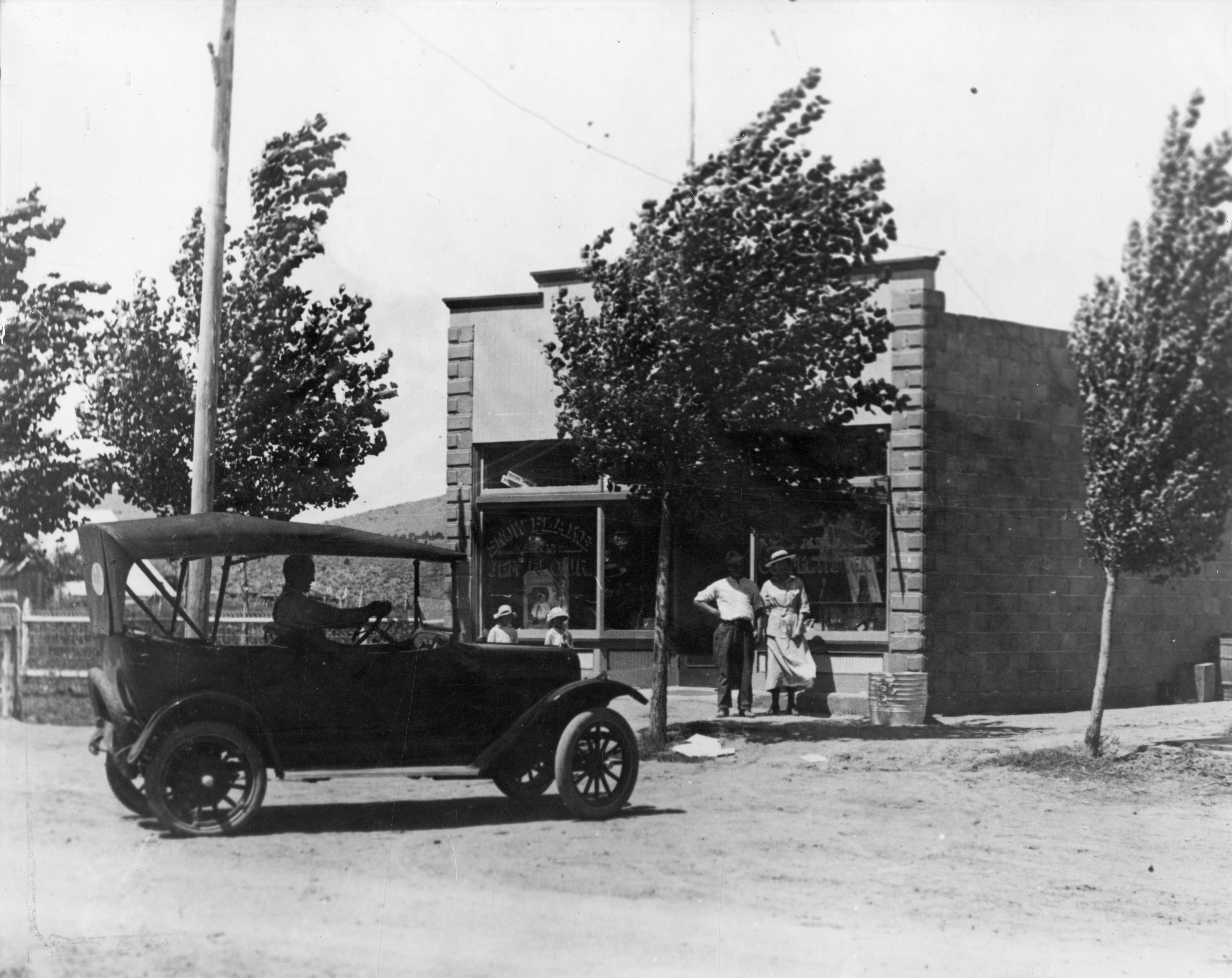 An old car in front of the Judd Store on Tabernacle in St. George